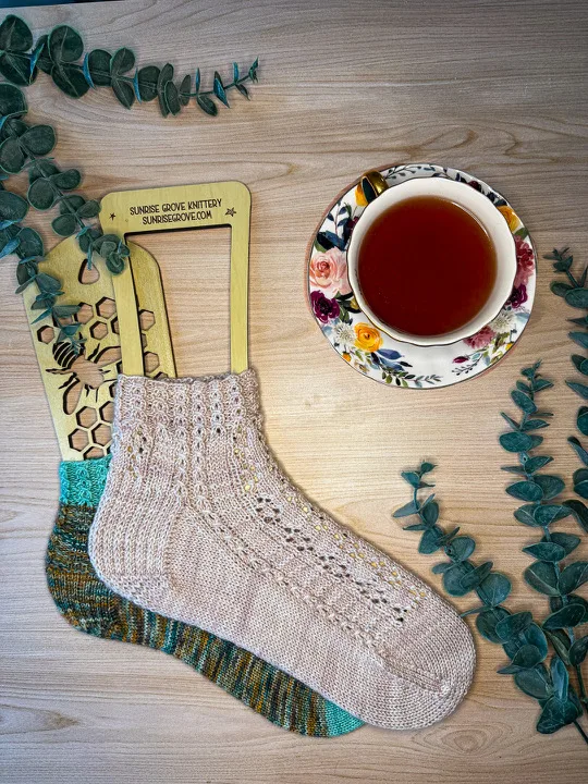 Second-Hand Sweater Weather Socks and Window Seat Socks posed perfectly for a shot of the sister patterns.